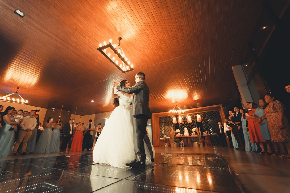 Newlyweds dancing happily at their reception